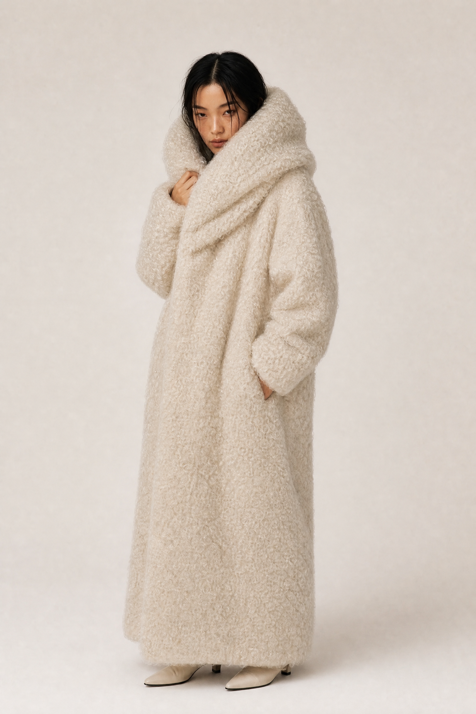 Cream coat model shot, three-quarter pose